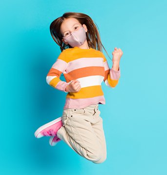 image of a girl jumping with a mask on